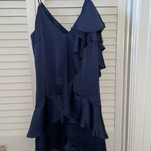 navy blue romper with an off the shoulder detail